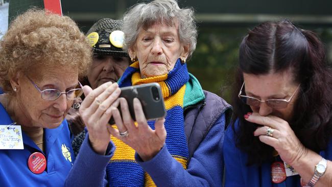 Onlookers outside Melbourne County Court react to the hearing. Picture: Michael Dodge/Getty Images