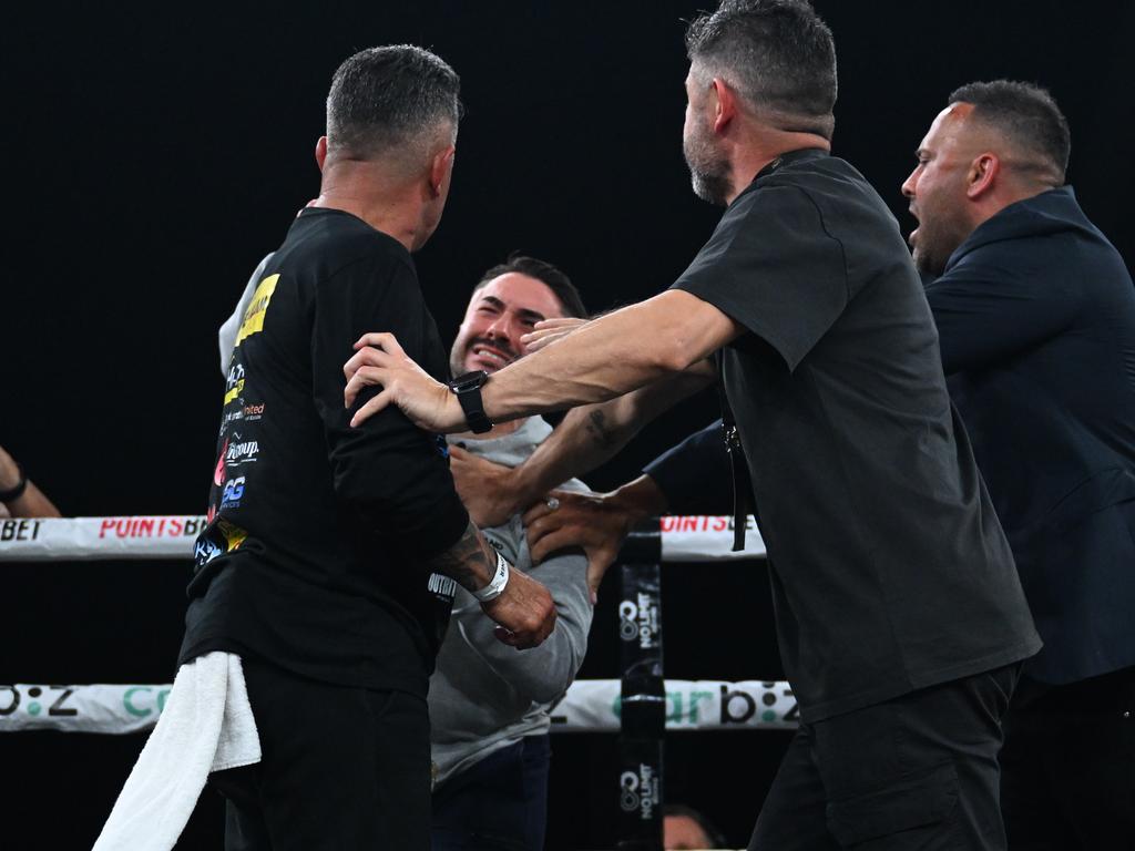 Zerafa’s brother (grey shirt) lands a punch on Tommy Mercuri. Picture: No Limit Boxing.