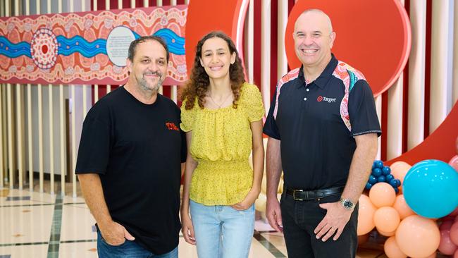 Target Group chief people and capability officer Tristan Gray, Indigenous Design Lab student Samara Francis and Indigenous Design Lab founder Leigh Harris unveil Target's new Deadly Store Network uniforms in Cairns on Tuesday. Photo: Supplied.