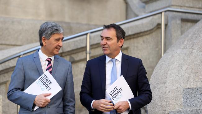 Eye of the tiger: Treasurer Rob Lucas and Premier Steven Marshall leave Parliament House with the 2019 Budget papers. (AAP Image/Kelly Barnes)