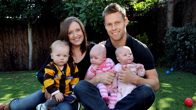 Hawthorn footballer Sam Mitchell with his wife Lyndall and children Emerson and Scarlett, 5 mths, and Smith 17mths.