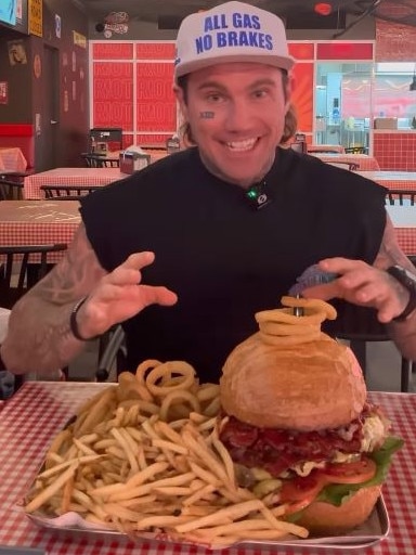 Online content creator and personal trainer Jimmy Judge taking on the giant 4 kilo burger challenge at Claw Brisbane.