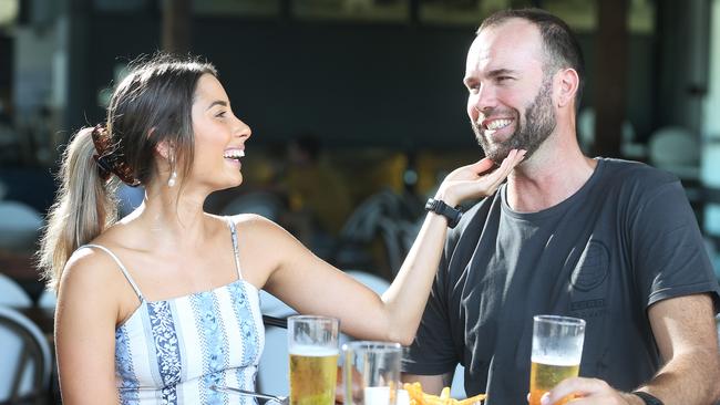 The Queensland Government has relaxed mandates on wearing face masks in public areas, meaning that patrons can breathe easier in hospitality venues. Shelby Crouche put on lipstick and Jason Preece trimmed his beard before catching up with friends at Hemingway's Brewery on Saturday afternoon. Picture: Brendan Radke