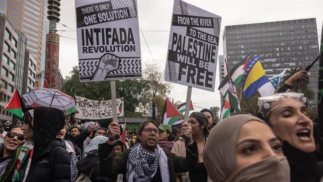 Pro-Palestine activists counter-protesting the “Never Again is Now” rally against anti-Semitism outside Victorian Parliament on Sunday. Picture: Getty Images