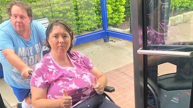 Disability pensioner Kim Trevithick, of Blacktown, gets into a “Loop” bus with her carer, Gerald McGowan, at Parramatta. 