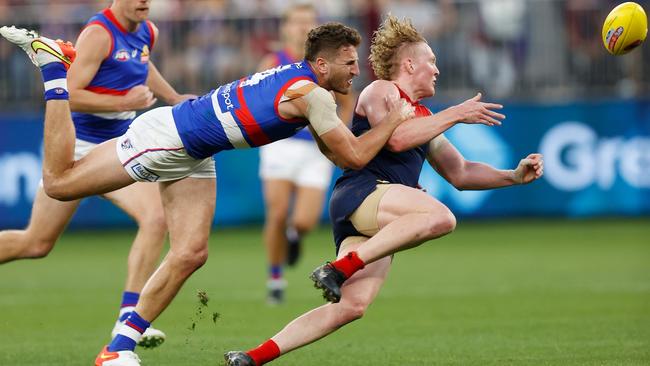 Marcus Bontempelli lands another tackle on Clayton Oliver. Picture: Michael Willson/AFL Photos via Getty Images