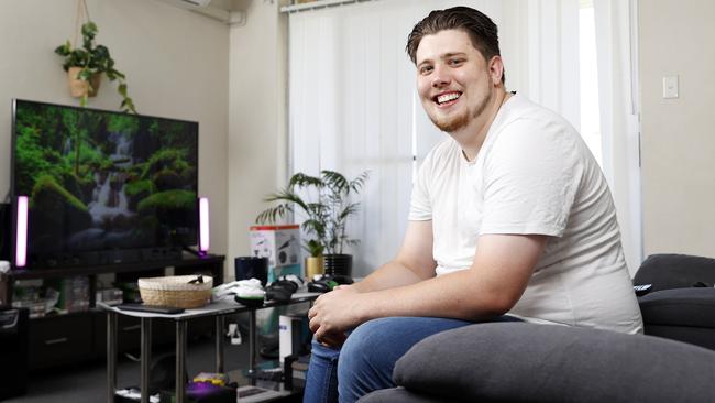 Jacob Osborne, 25, was in foster care and then a refuge as a child, but is now in a private rental in Leumeah and works in car sales. Picture: Jonathan Ng