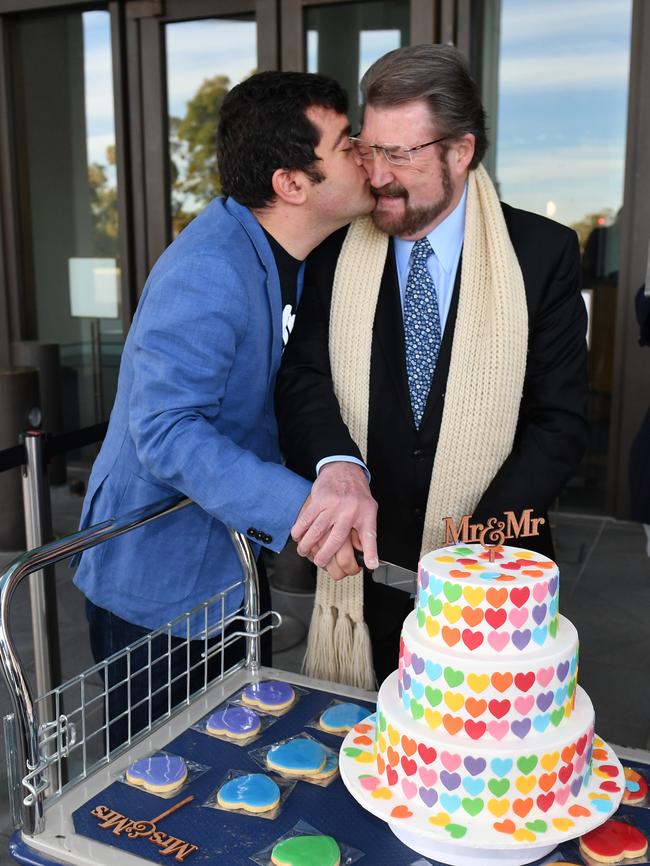 Labor Senator Sam Dastyari kisses Derryn Hinch's after cutting a Marriage Equality Cake in August.