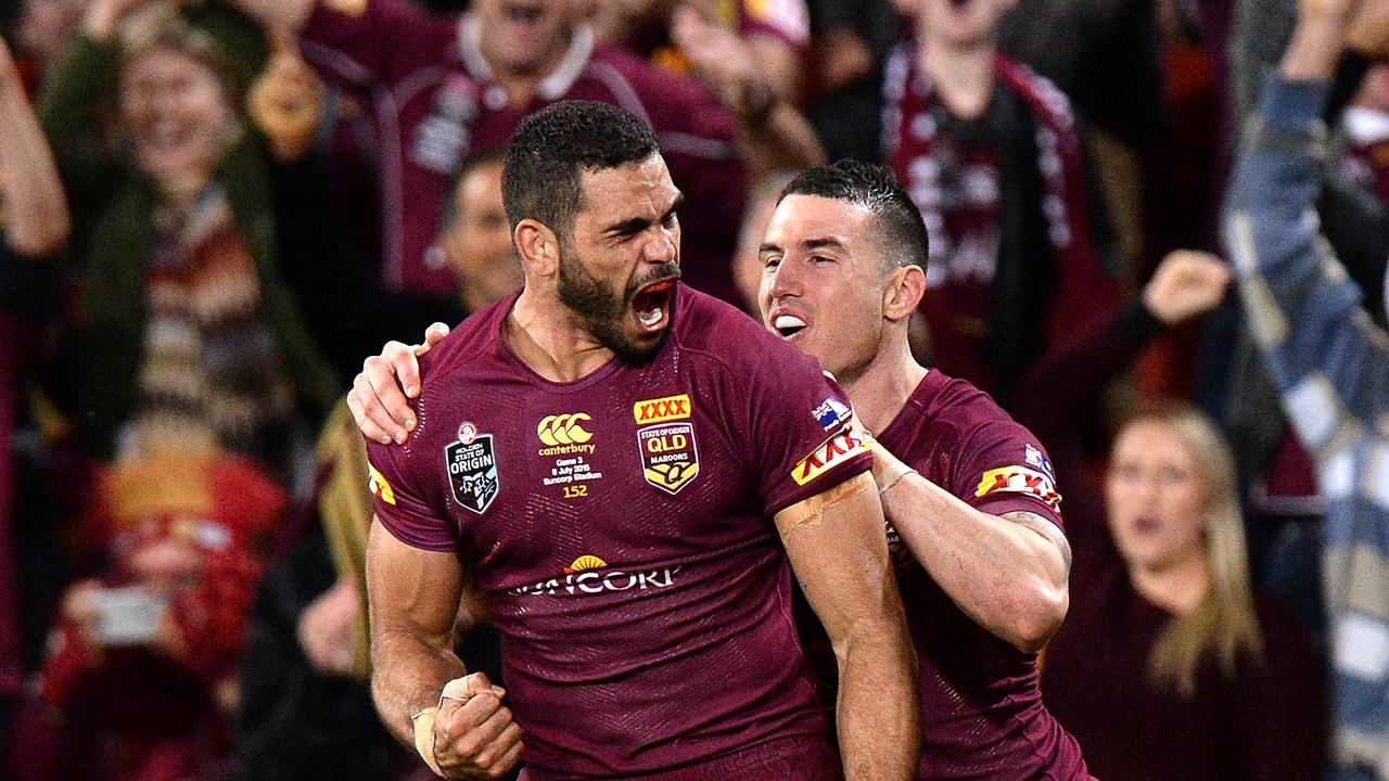 Greg Inglis of the Maroons celebrates a try during game three of the 2015 series