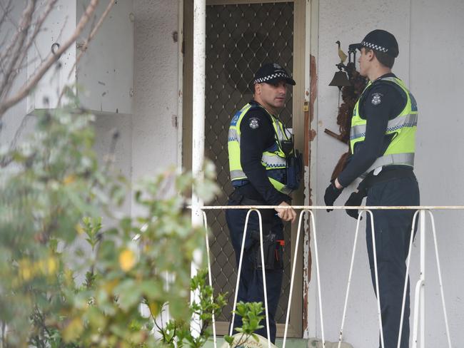 Police officers door knock houses in the area near where the three children were found injured at a home in Broadmeadows, Melbourne. Picture: AAP