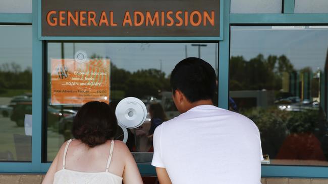 Visitors to the Indianapolis Zoo purchase tickets. Picture: Michael Conroy/AP