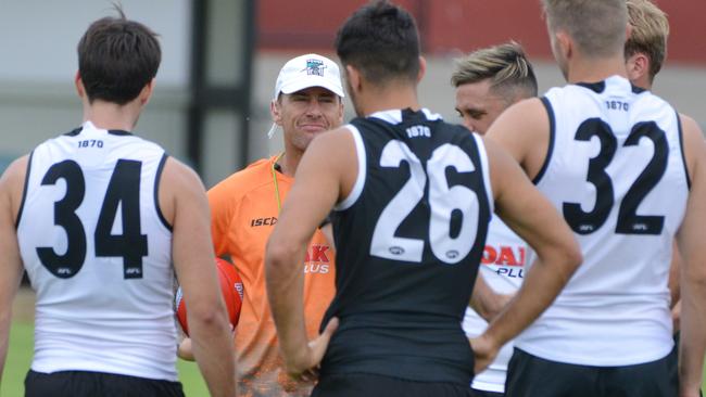 Port Adelaide assistant coach talks to players at training on Monday.