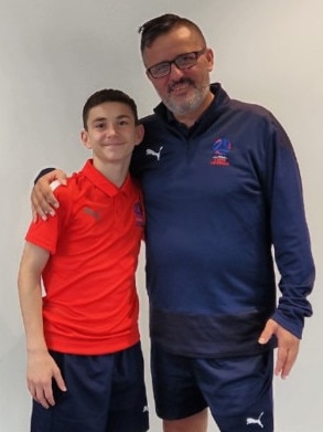 South Australian U13 futsal player Massimo Mallamo with coach Spiros. He was named among the top performers at Futsal Nationals.