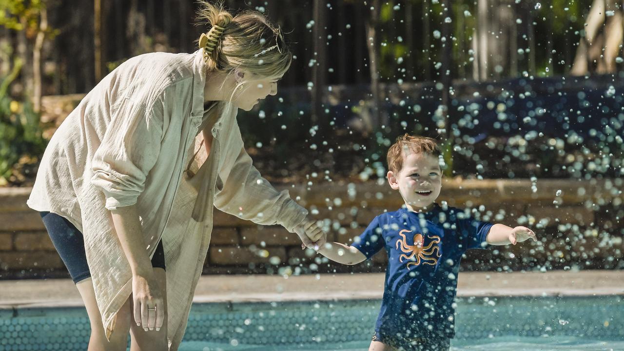 Lauren and Kailo, 3, enjoy the water at Tusmore wading pool. Picture: NCA NewsWire / Roy VanDerVegt