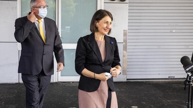 Gladys Berejiklian and NSW Minister for Health and Medical Research Brad Hazzard arrive for a press conference at Westmead Hospital. Picture: Getty Images.