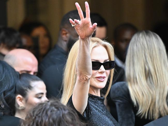 The Aussie actress waves to the crowd from behind dark sunnies. Picture: Stephane Cardinale - Corbis/Corbis via Getty Images