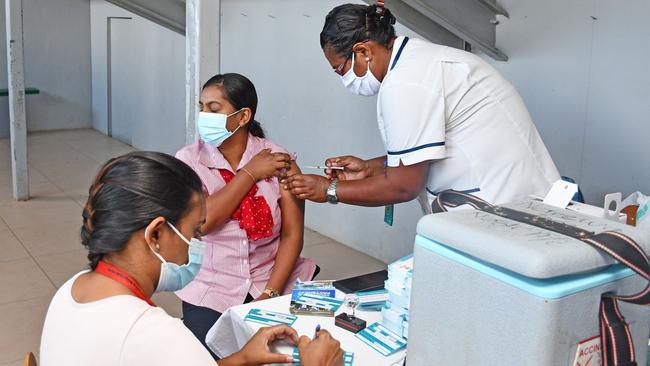 Nurses administer vaccines to locals in Fiji. Picture: Supplied