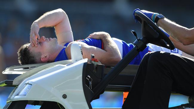 Toby McLean leaving the ground after suffering a serious knee injury. Picture: Mark Brake/Getty Images