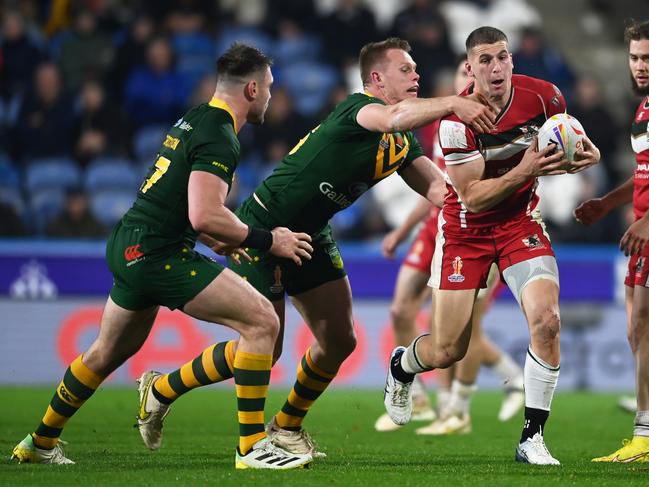 Adam Doueihi of Lebanon is tackled by Lindsay Collins of Australia. Picture: Gareth Copley/Getty Images