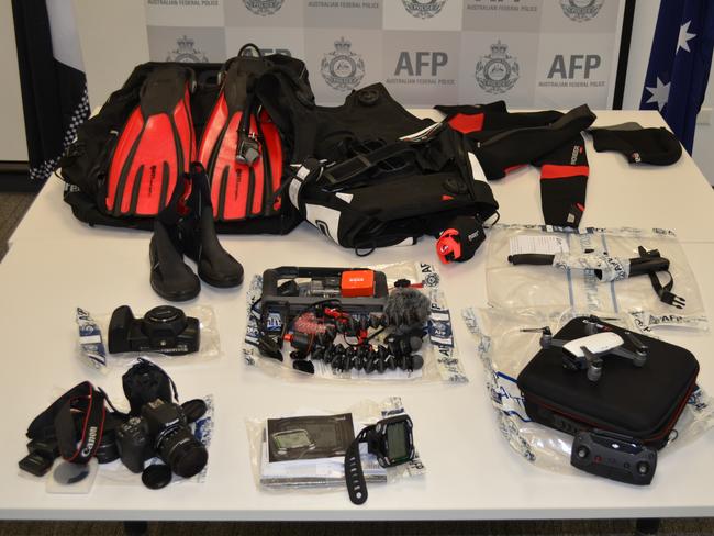 AFP images of the restrained assets, including camera equipment, a drone and scuba diving gear.