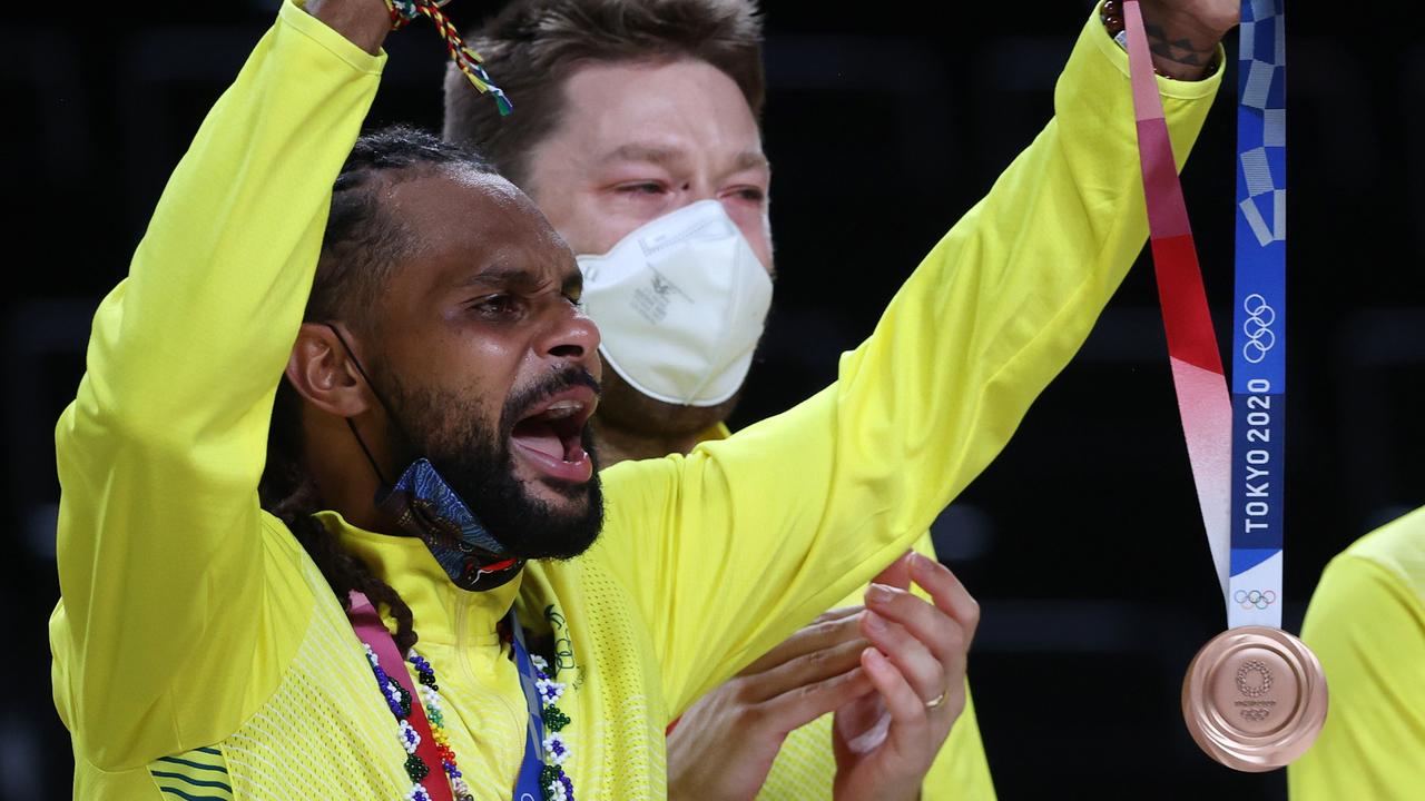 Patty Mills celebrates with his bronze medal after beating Slovenia at the Tokyo Olympics. Picture: Getty