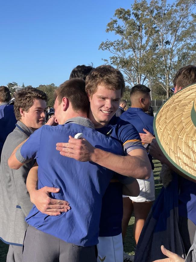 Churchie winger Mac Kelley is congratulated.