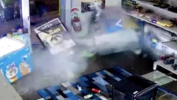 The moment an ATM is ripped from the floor inside a tobacconist on Myall Rd, Tea Gardens on March 16, 2024. Picture: NBN News.