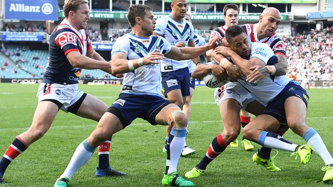 Jarryd Hayne can’t evade Blake Ferguson. (AAP Image/David Moir)