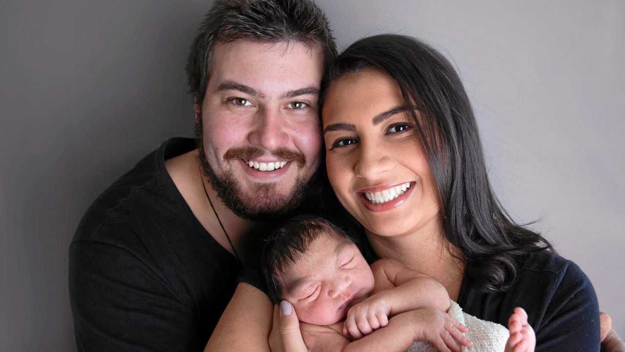 LOVE AND CARE: Rachel and Shea Edwards with their daughter Mia. Mia has a rare brain condition that comes with a life expectancy of seven-10 years. Picture: Sue Louise Photography