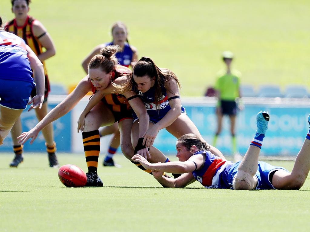 AFL Cairns Womens, Round 1: Manunda Hawks v Centrals Trinity Beach at Cazalys. Hawks' Jennifer Damon, Bulldogs' Taylor Drewitt and Kat Fatnowna. Picture: Stewart McLean