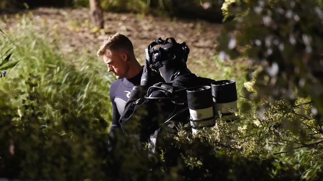 Divers search the Werribee River. Picture: Josie Hayden