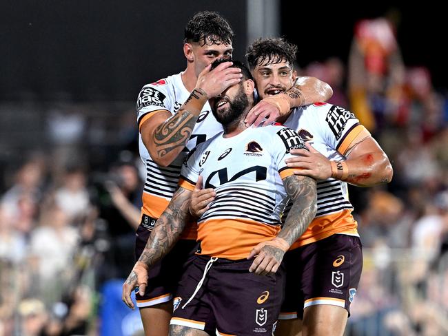 Adam Reynolds of the Broncos is congratulated by Jordan Riki and Kotoni Staggs. Picture: Getty Images