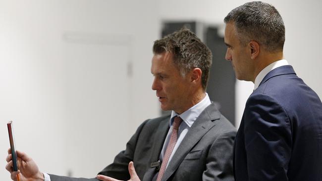 NSW Premier Chris Minns, left, and South Australian Premier Peter Malinauskas record a short piece for social media at the social media summit in Sydney’s Darling Harbour. Picture: John Appleyard / NewsWire