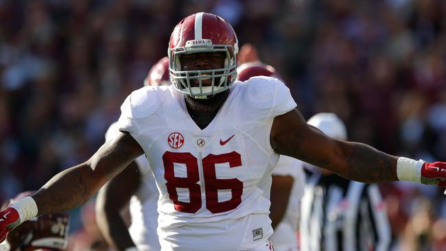 STARKVILLE, MS - NOVEMBER 14: A'Shawn Robinson #86 of the Alabama Crimson Tide reacts after sacking Dak Prescott #15 of the Mississippi State Bulldogs on the first play of the game at Davis Wade Stadium on November 14, 2015 in Starkville, Mississippi. (Photo by Kevin C. Cox/Getty Images)