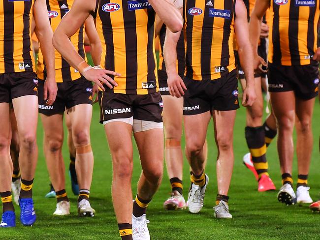 ADELAIDE, AUSTRALIA - AUGUST 27: Dejected Hawthorn players leave the ground during the round 14 AFL match between the Hawthorn Hawks and the Essendon Bombers at Adelaide Oval on August 27, 2020 in Adelaide, Australia. (Photo by Mark Brake/Getty Images)