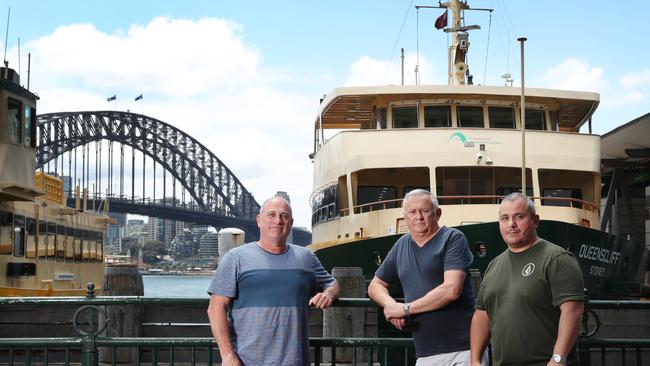 Former wharfies Matt Lawrence, Tony Burgess and Nathan Donato with one of the Freshwater Class ferries slated to be decommissioned by the state government. Wharfies are banding together in a bid to save them. Picture: Richard Dobson