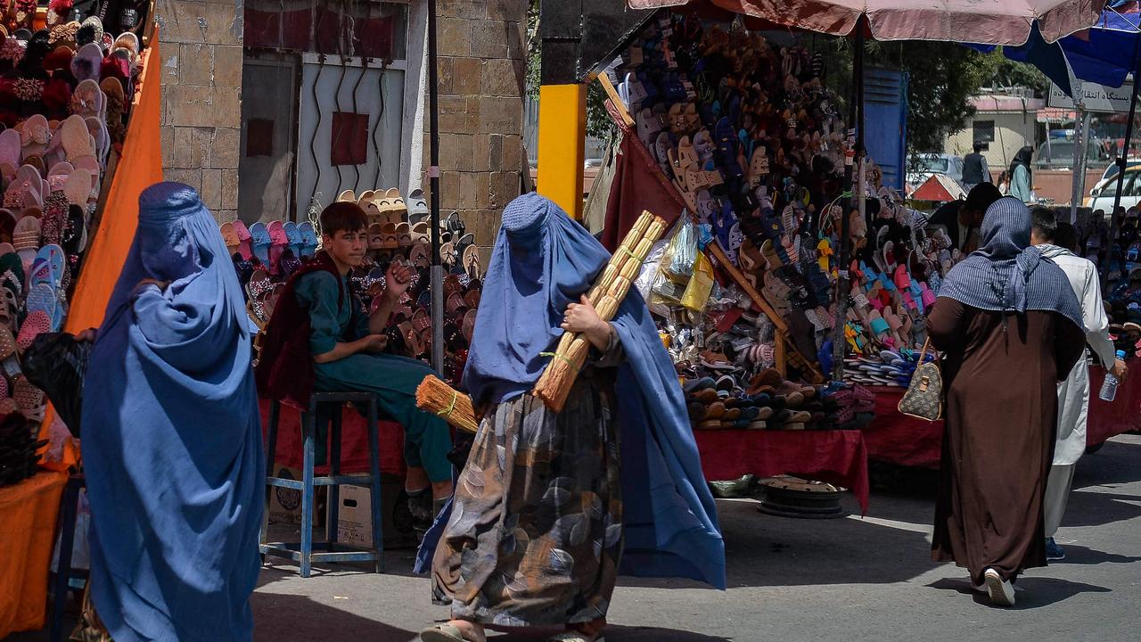 Burqa clad Afghan women shop at a market area in Kabul on August 23. Picture: Hashimi