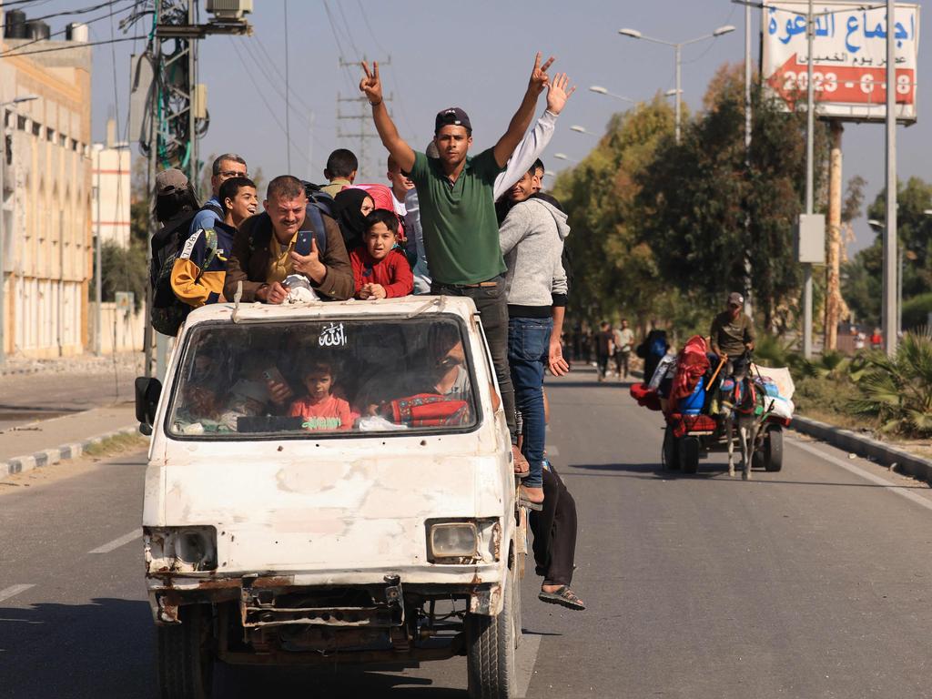 Palestinians gesture as they flee Gaza City towards the southern areas. Picture: AFP