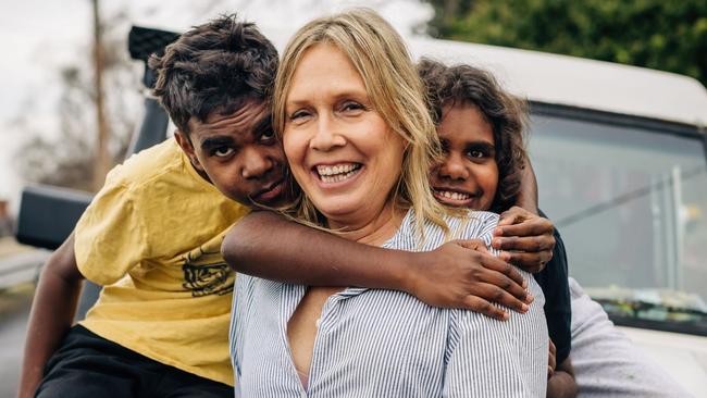 Amanda Ducker (centre) with Leslie (left) and Naida (right) outside their Hobart home. Picture: Adam Gibson