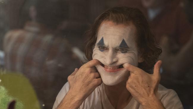 This image released by Warner Bros. Pictures shows Joaquin Phoenix in a scene from "Joker," in theaters on Oct. 4.  (Niko Tavernise/Warner Bros. Pictures via AP)