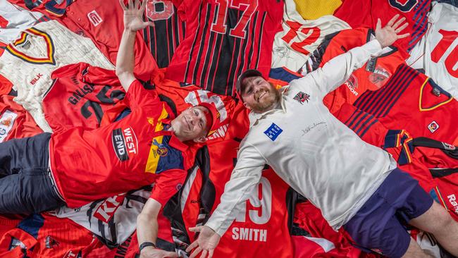 Jim Congdon (right) and Lachlan McAuliffe with a collection of their cricket shirts. Picture: Ben Clark