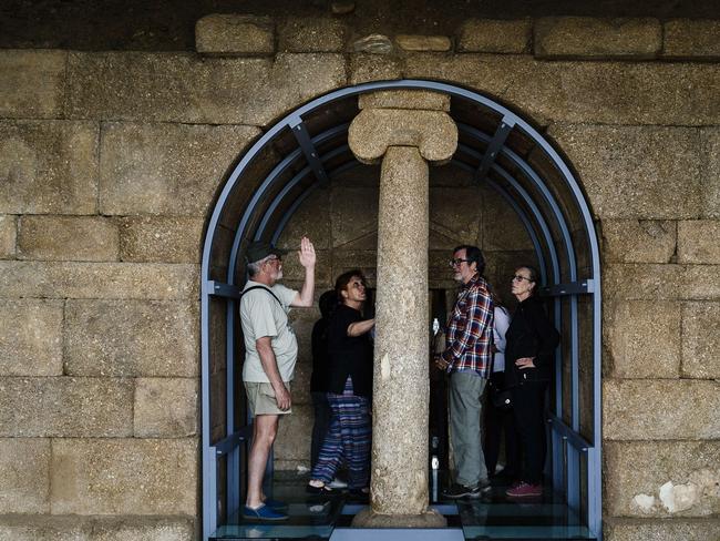 Tourists examine the Thracian tomb of Shushmanets.