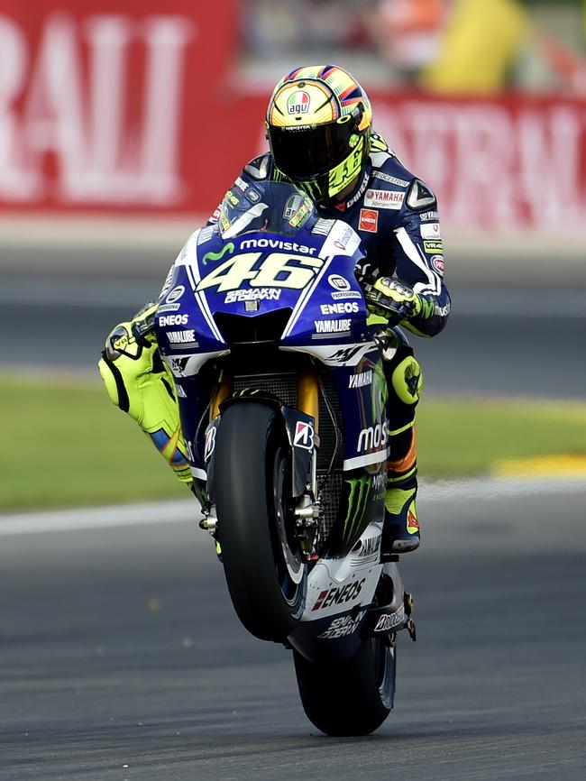 Valentino Rossi wheelies during the Moto GP qualifying session ahead of the Valencia Grand Prix. Picture: AFP PHOTO/JOSE JORDAN.