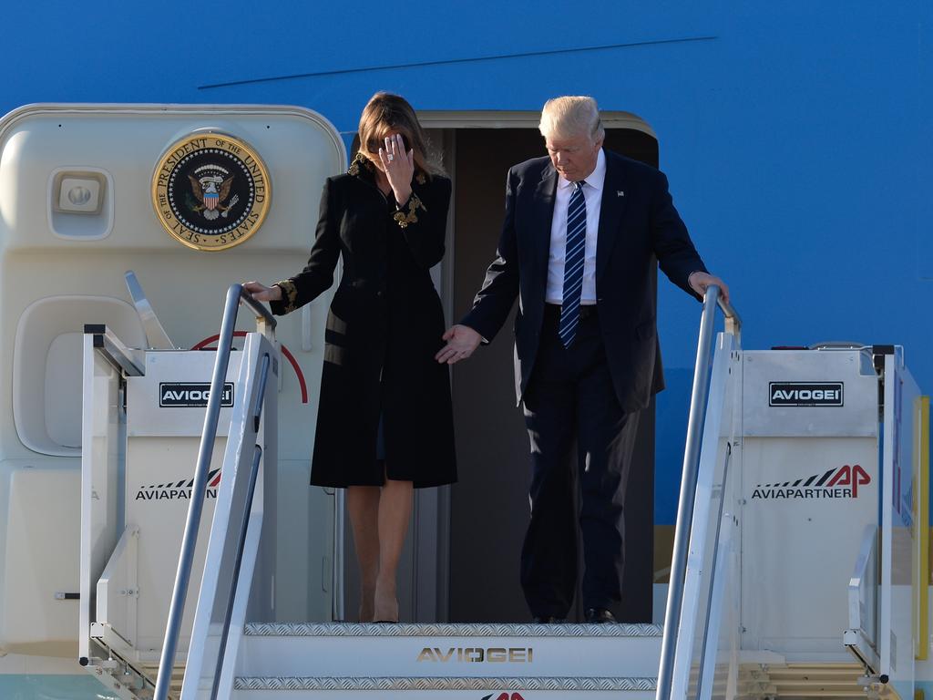 First Lady Melania Trump refuses to touch Donald Trump's hand at Airport Fiumicino in Rome. It becomes a pattern throughout his presidency. Picture: Getty Images