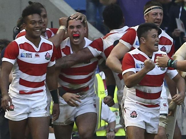 Japan players celebrate the greatest upset in rugby’s history.