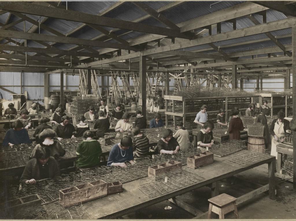 A number of women work on the spring frames of vehicle seats in a section of Holden’s Motor Body Builders workshop.