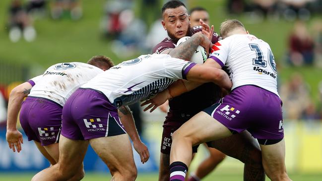 Melbourne’s Addin Fonua-Blake is wrapped up by the Manly defence. Picture: AAP