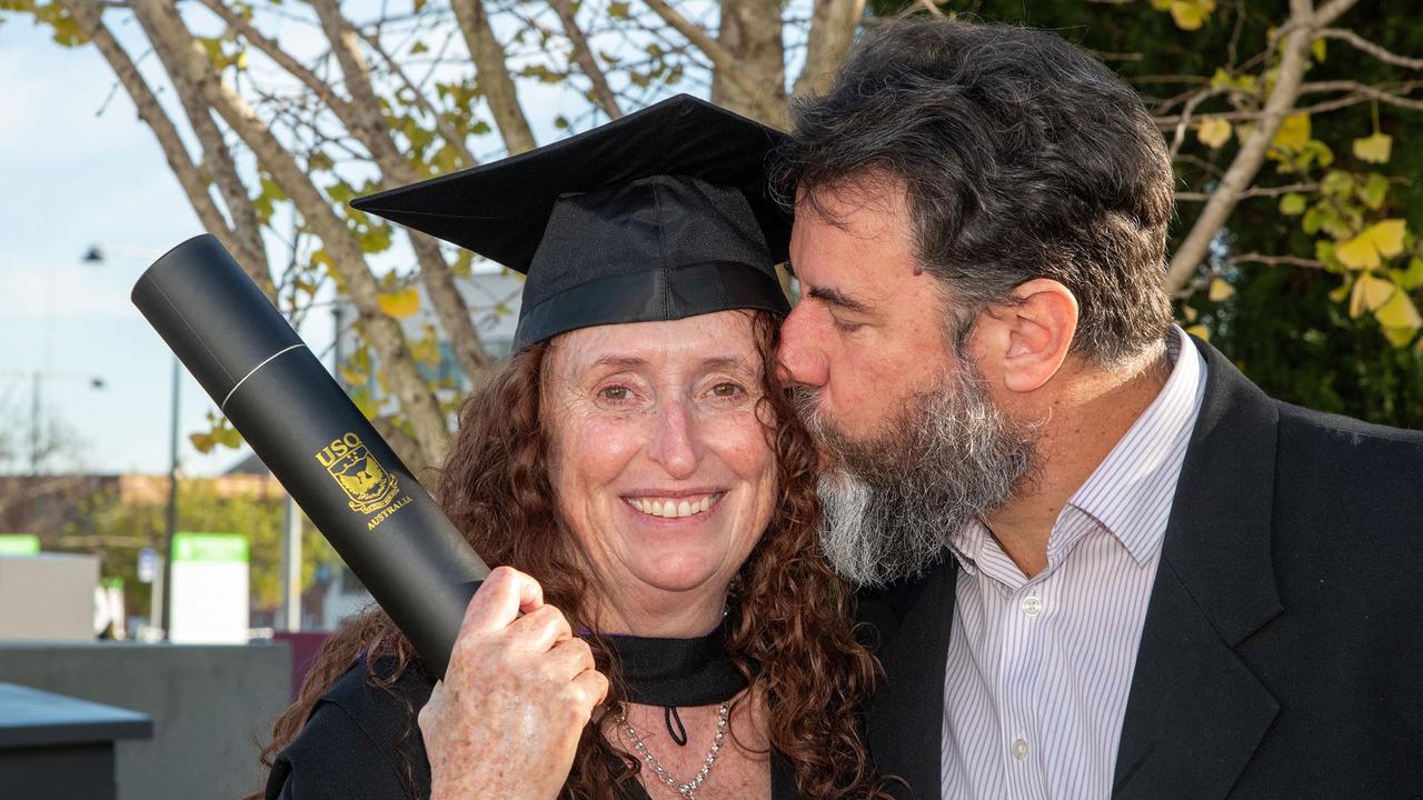 Peter Bowen congratulates his wife, Tracy, on her graduation with Bachelor of Laws with Honours First Class. UniSQ graduation ceremony at Empire Theatre. Wednesday, June 28, 2023