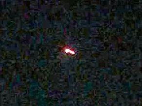 A Glenwood man says he's seen what looked like a UFO hovering near the mountains last night. (A Gladstone man took this photo of an object flying over Tannum Sands). . Picture: Contributed.