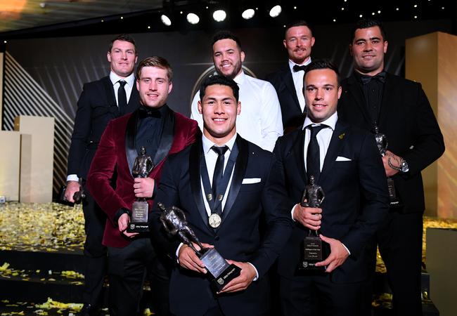 2018 Dally M team of the year headed by winner Roger Tuivasa-Sheck (centre). Also in the team are (L-R) Josh Jackson (second rower), Cameron Munster (five-eighth), Jazz Tevaga (interchange), Damien Cook (hooker), Luke Brooks (halfback) and Andrew Fifita (prop).